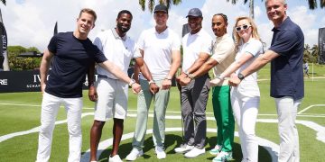 MIAMI BEACH, FLORIDA - MAY 04: (L-R) IWC Schaffhausen CEO Christoph Grainger-Herr, Dibia DREAM Founder and CEO Brandon Okpalobi, IWC brand ambassador and seven-time World Champion quarterback Tom Brady, Retired American Football running back Marcus Allen, IWC brand ambassador and seven-time Formula One World Champion Lewis Hamilton, American actor Kathryn Newton and Former F1 driver David Coulthard during The Big Pilot Challenge, an entertaining charity golf challenge organized by IWC Schaffhausen at the Miami Beach Golf Club on May 4, 2022 in Miami Beach, Florida. (Photo by Alexander Tamargo/Getty Images for IWC Schaffhausen)
